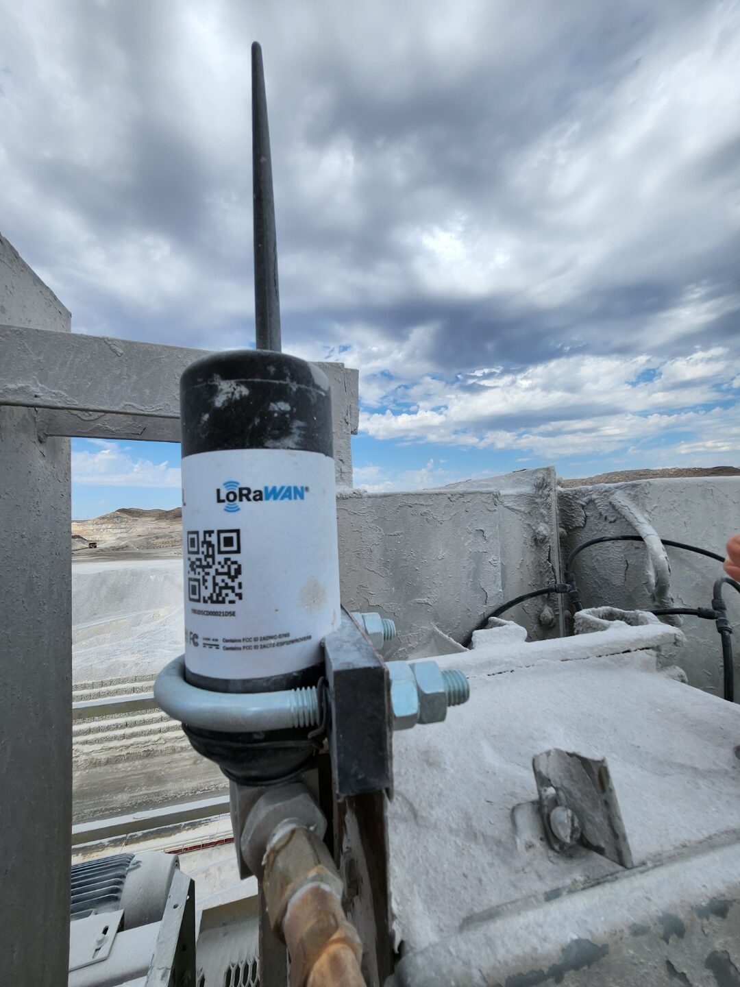 Outdoor LoRaWAN sensor antenna mounted at open-pit mining operation